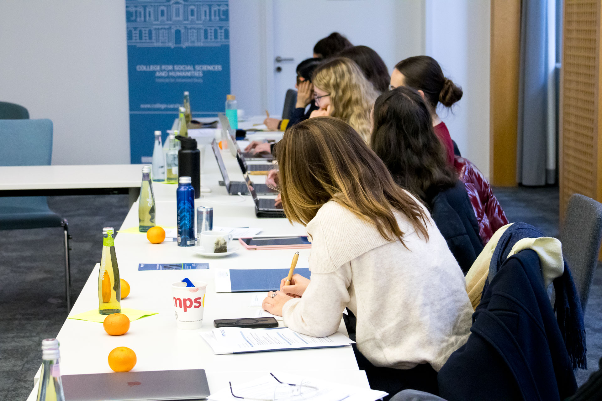 photo from the workshop 'Perpetrator Memory in Spanish culture', participants sitting at a table