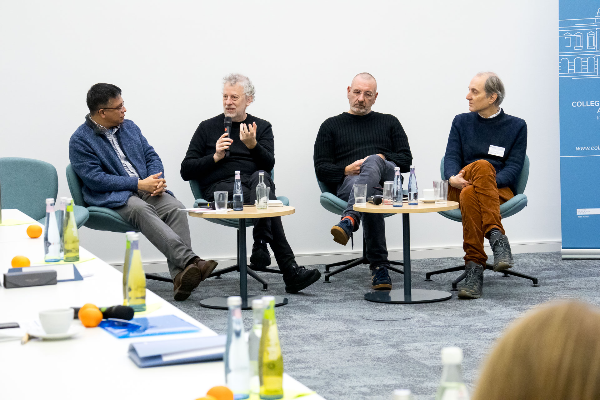 photo from the workshop 'Perpetrator Memory in Spanish culture', panelists sitting in front of the audience, one speaking