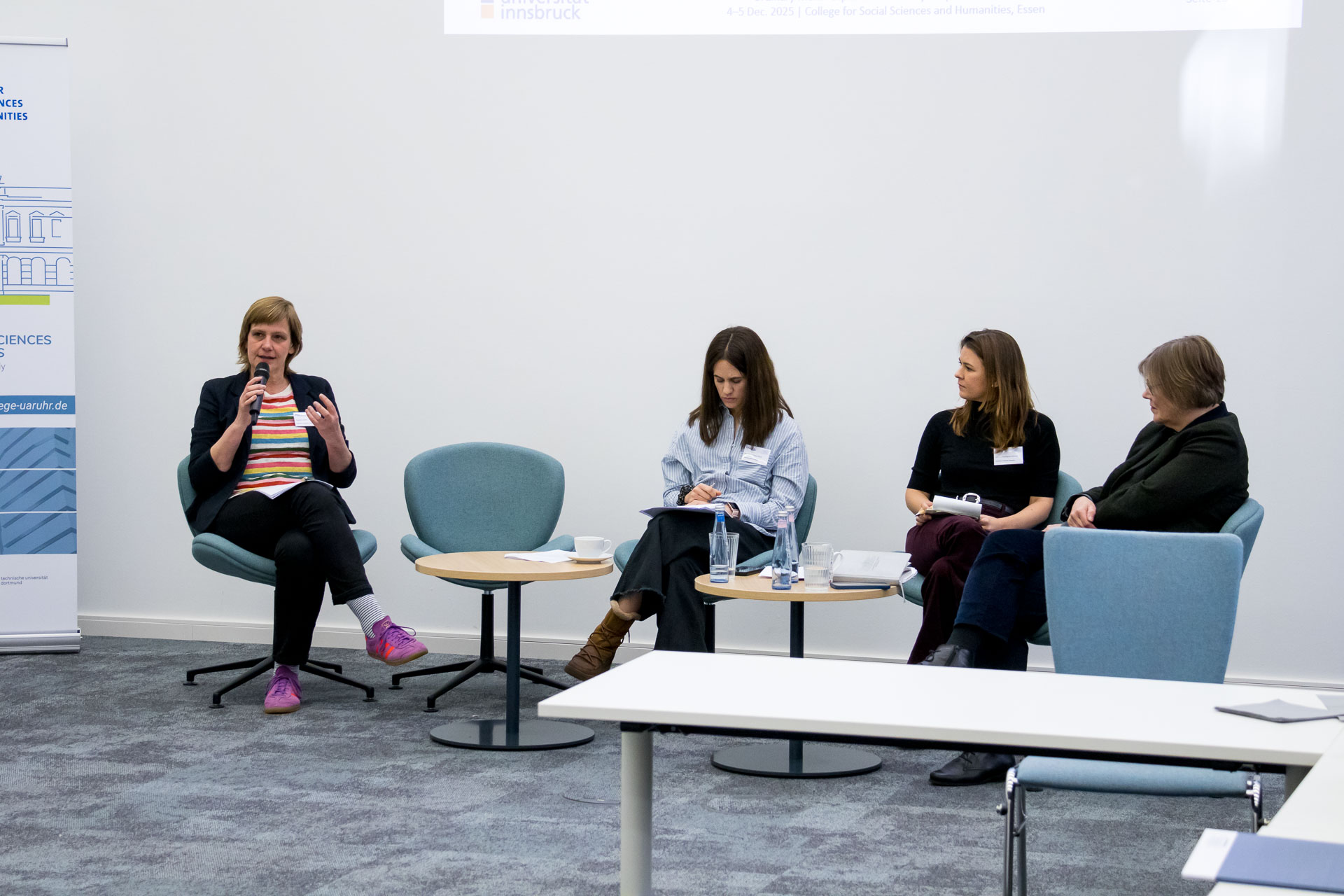 photo from the workshop 'Perpetrator Memory in Spanish culture', panellists sitting around a table