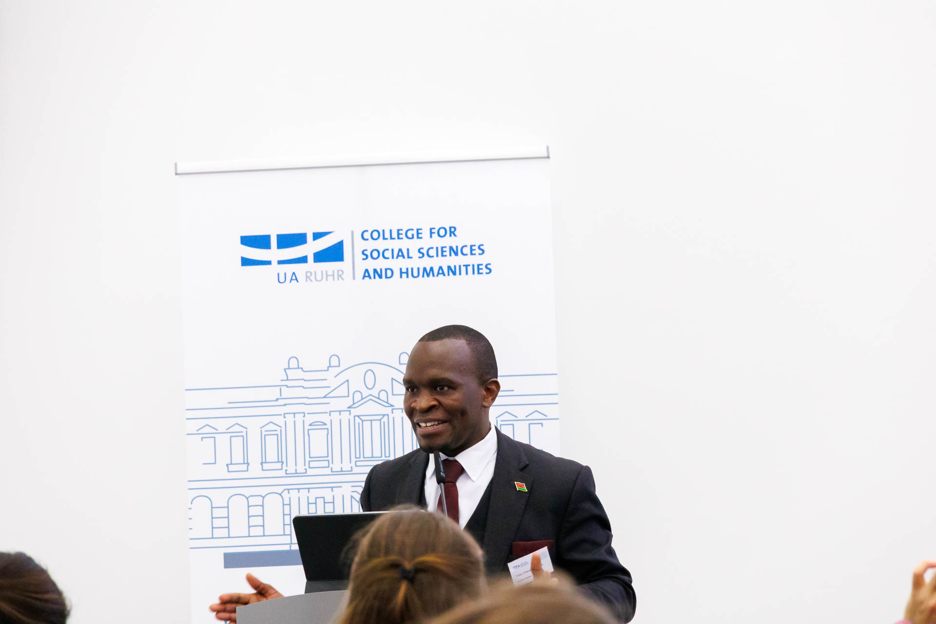 photo from the conference, speaker addressing the audience