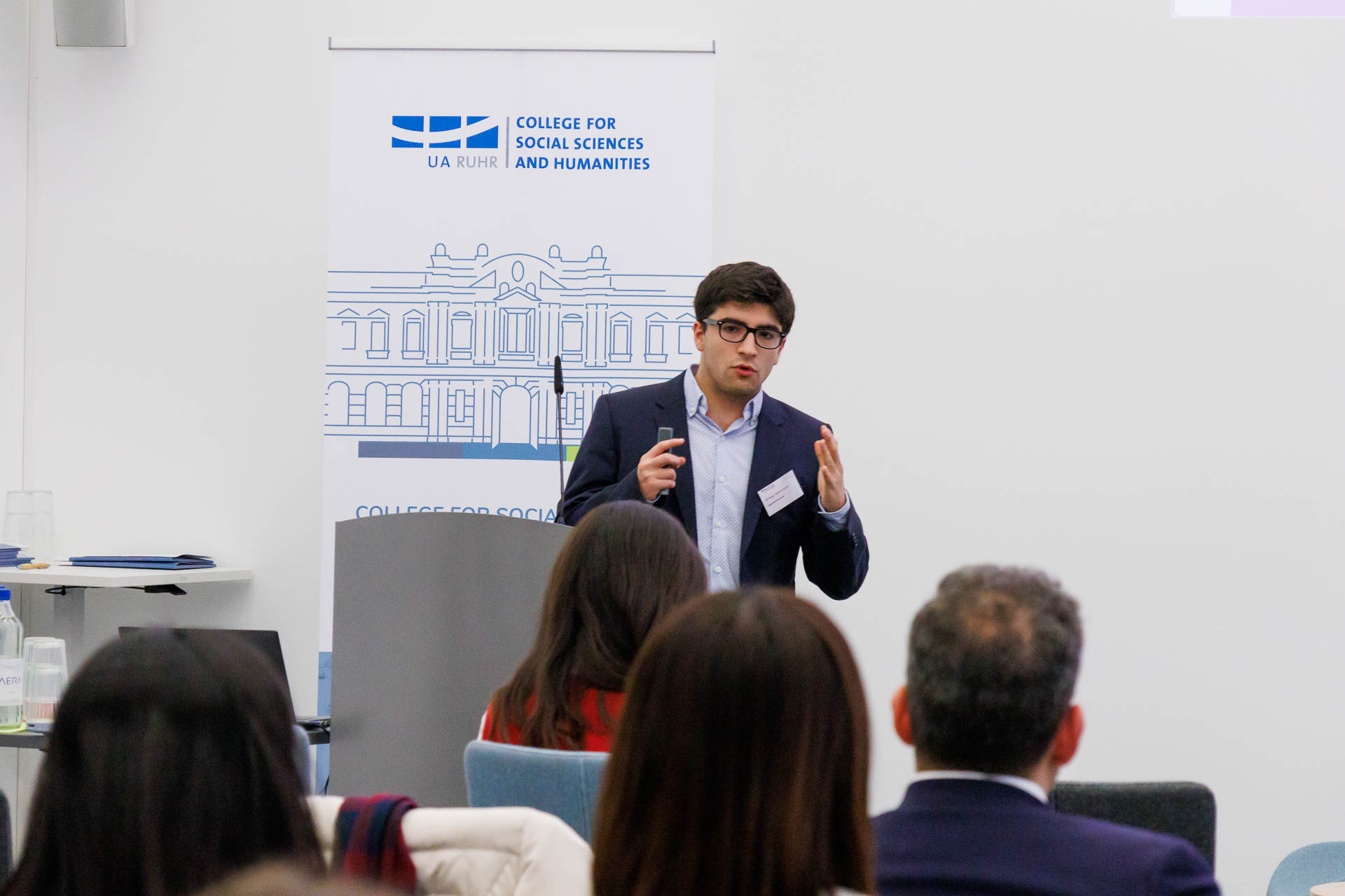 photo from the conference, speaker addressing the audience