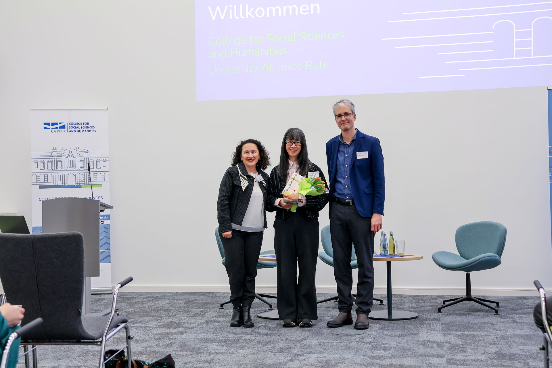 photo from the workshop 'Ethnic-Racial Socialisation', the convenors with Linda Juang who is holding flowers