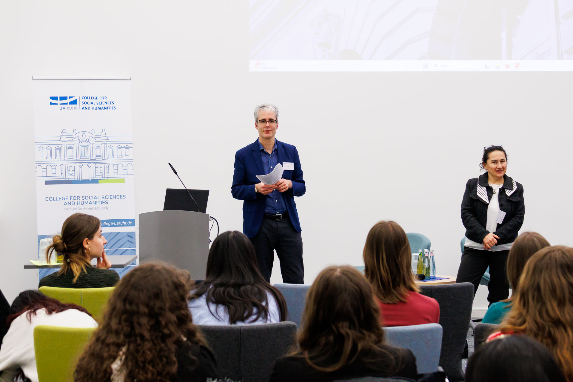 photo from the workshop 'Ethnic-Racial Socialisation', the two convenors standing in front of the audience